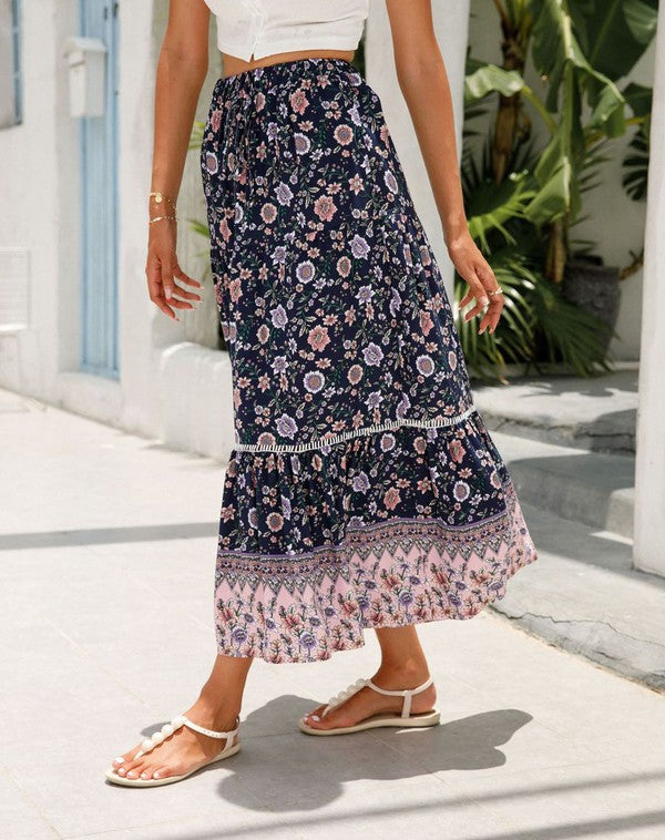Floral midi skirt for women by Jade Icarus, showcasing a flowing design with vibrant flower patterns.