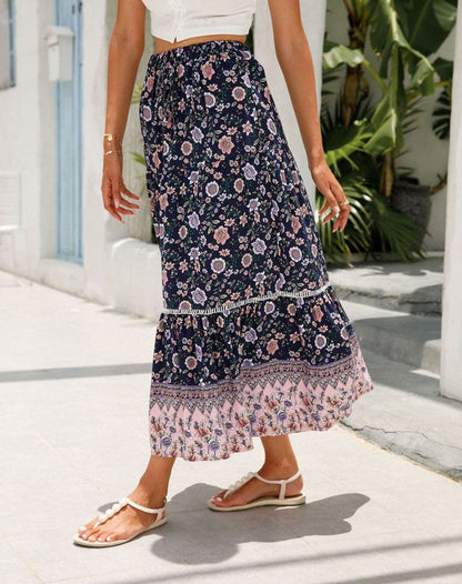 Floral midi skirt for women by Jade Icarus, showcasing a flowing design with vibrant flower patterns.