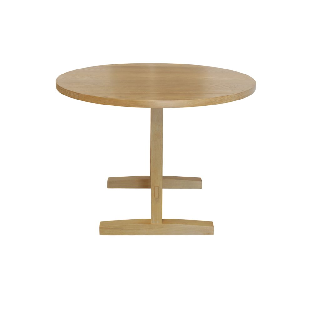 Start2Finish Eleanor round dining table with smooth wooden surface and sturdy base, ideal for modern kitchen or dining room settings.