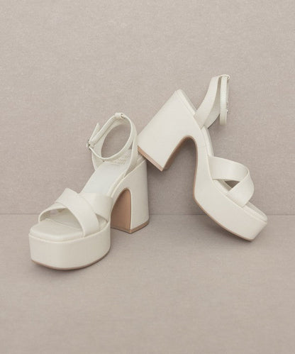 Jade Icarus Oasis Society Norah chunky platform heel in black leather with thick block heel and ankle strap on a white background.
