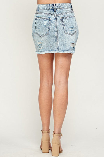 Women’s denim mini skirt by Jade Icarus featuring classic cut and light blue wash, styled with pockets and belt loops.