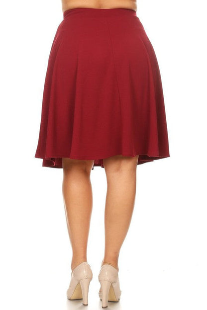 Solid high-waisted A-line knee-length skirt for women by Jade Icarus, displayed in a natural fabric and classic design.