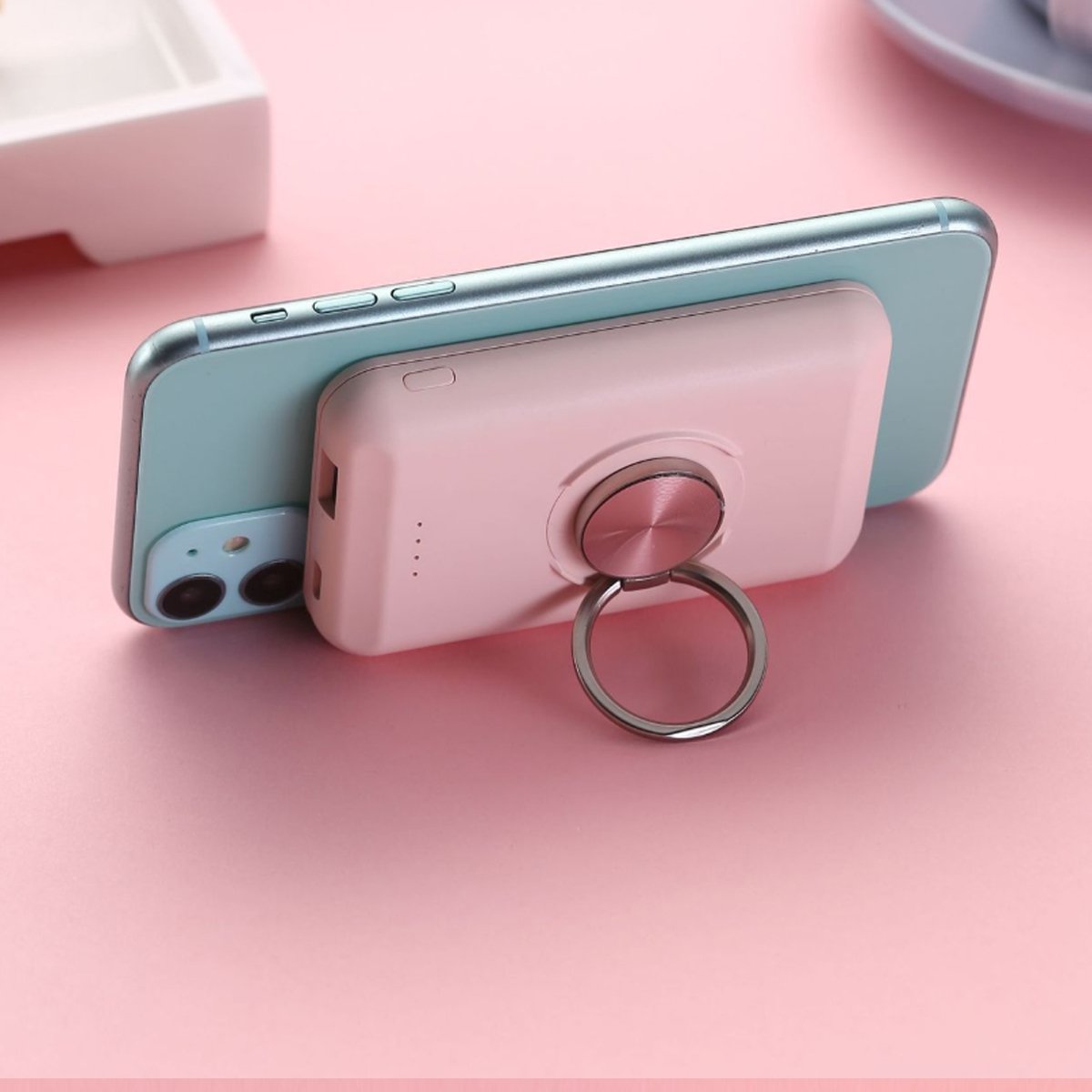 Salmon Lucky wireless magnetic charger and power bank for iPhone 12 showing the sleek device connected with a magnetic attachment.