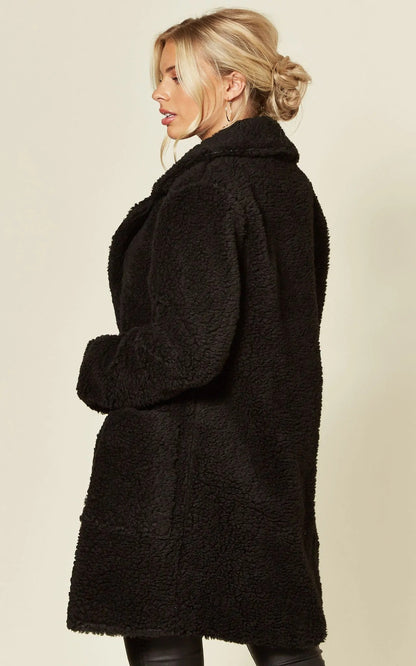 Black Rose Eleusis Borg Teddy Coat with stud button details, cozy jacket featuring a plush, textured borg fabric and stylish design.