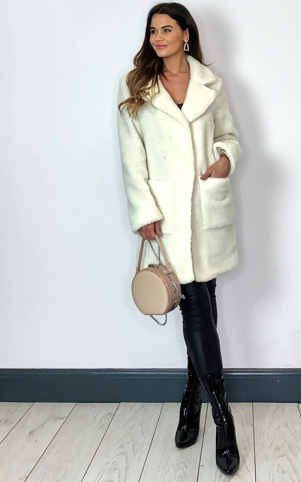 Cream Rose Eleusis Borg Teddy Coat with stud buttons, showcasing its soft, plush borg fabric and stylish jacket design.