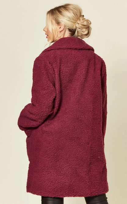 Rose Eleusis stud button borg teddy coat in fuchsia, a stylish jacket with plush fabric and button details.