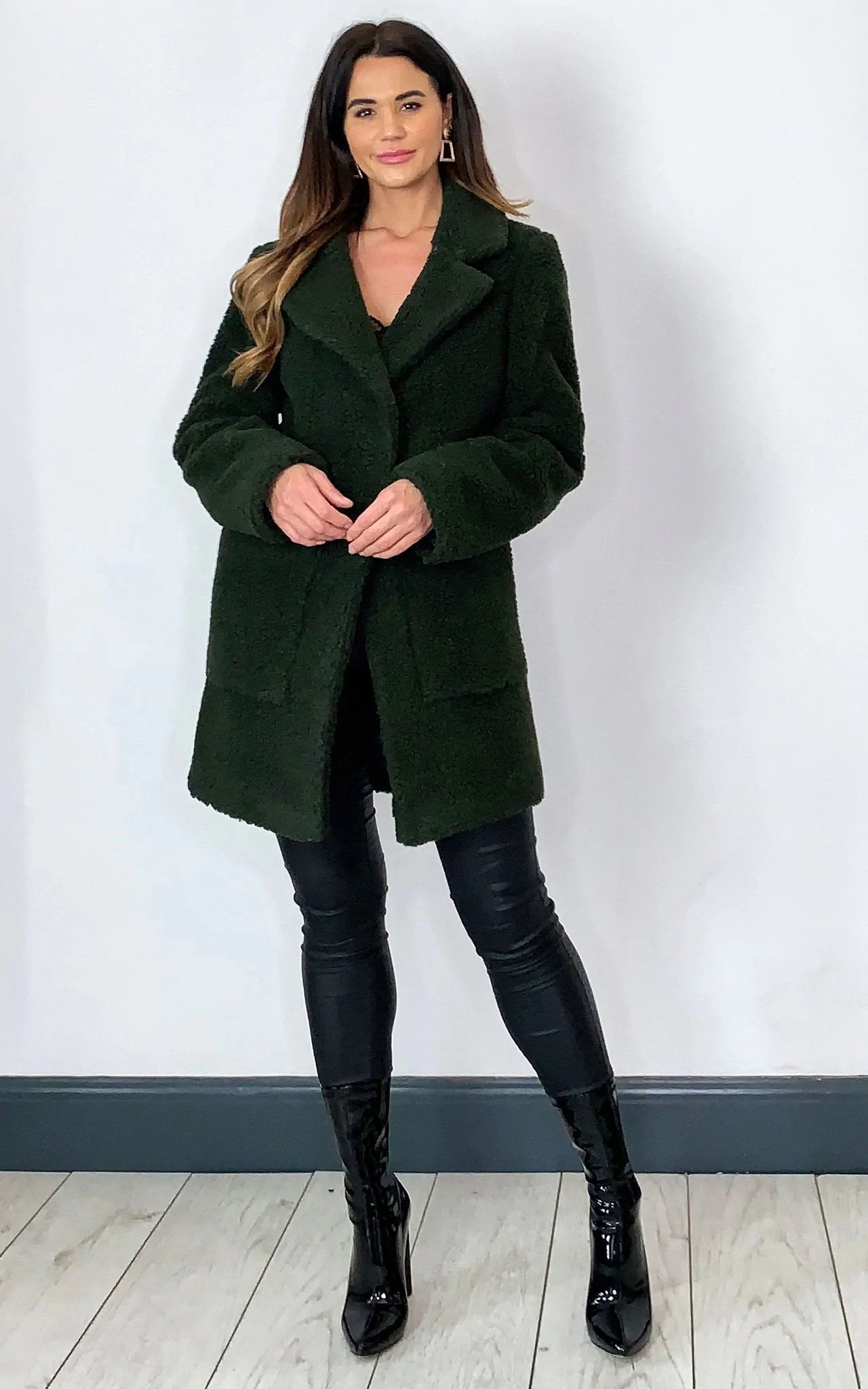 Olive green Rose Eleusis Stud Button Borg Teddy Coat, a cozy jacket with button details and soft textured fabric.