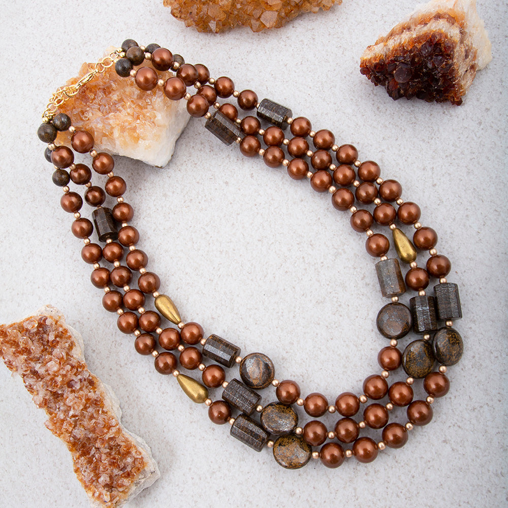 Mocha brown pearl and gold statement necklace from Start2Finish featuring a bold jewelry design with elegant pearls and gold accents.