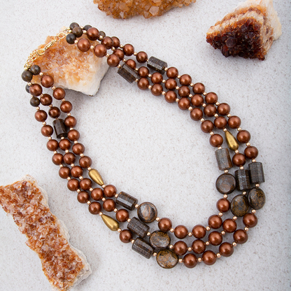 Mocha brown pearl and gold statement necklace from Start2Finish featuring a bold jewelry design with elegant pearls and gold accents.