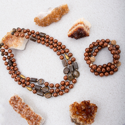 Mocha brown pearl and gold statement necklace from Start2Finish, featuring a bold, elegant jewelry design with shimmering pearls.