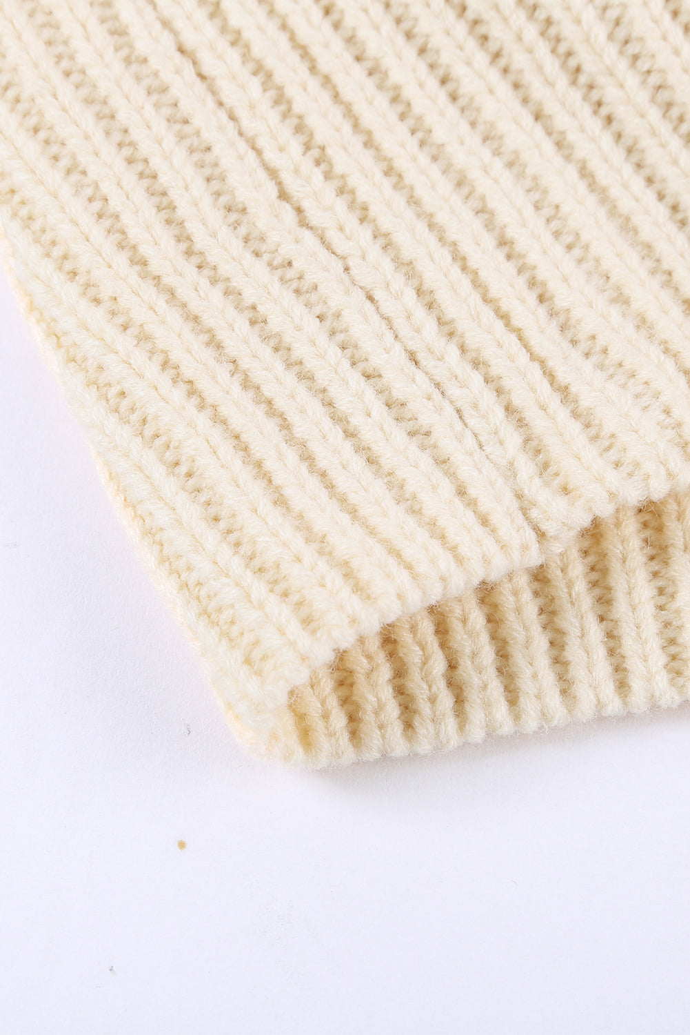 Beige wrap V-neck sweater with side tie from Harlequin Daisy, perfect for cozy bath and beauty lounging.