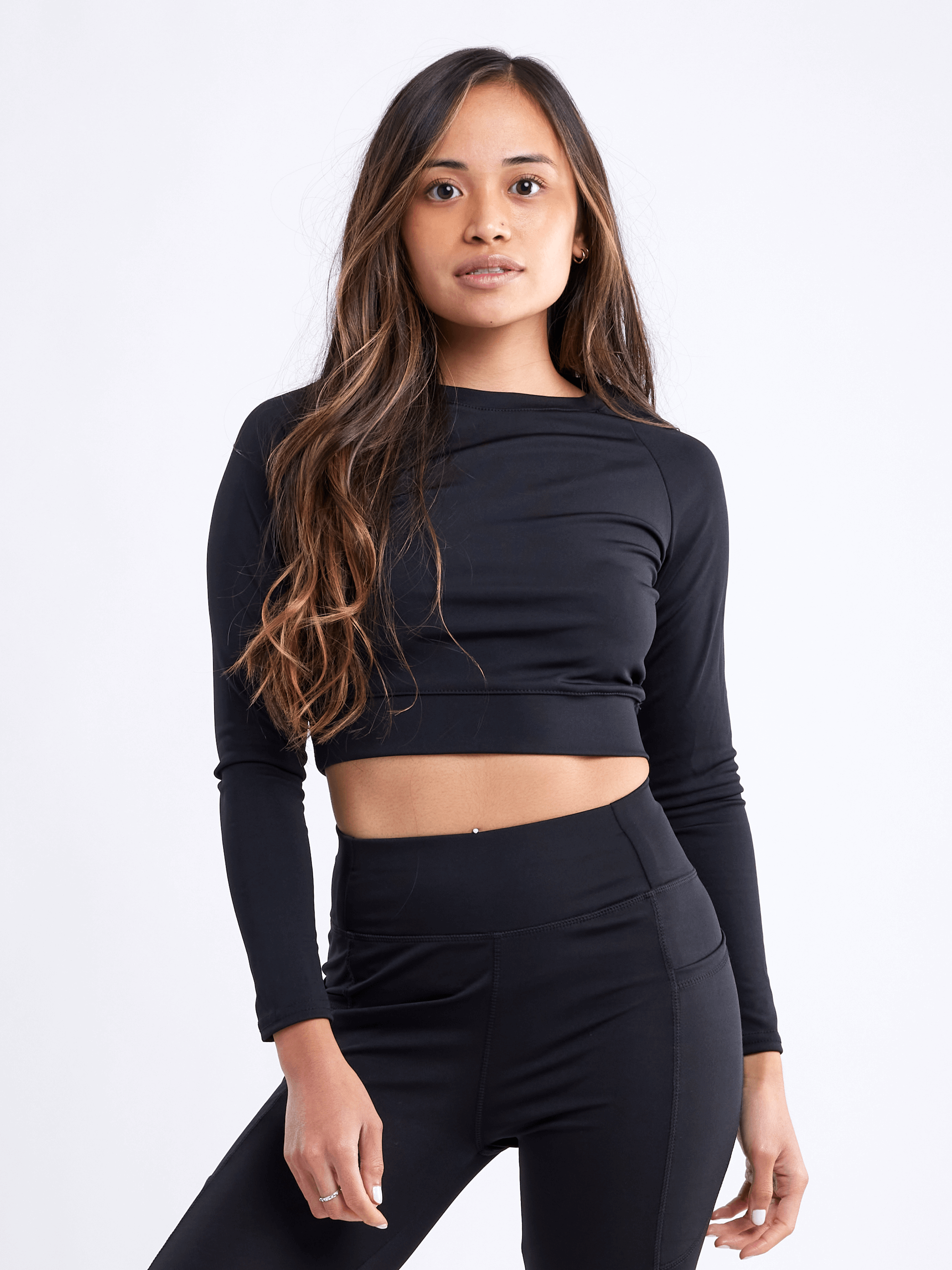 Black Lavender JupiterGear long-sleeve crop top for activewear, shown in a stylish black color with fitted design.