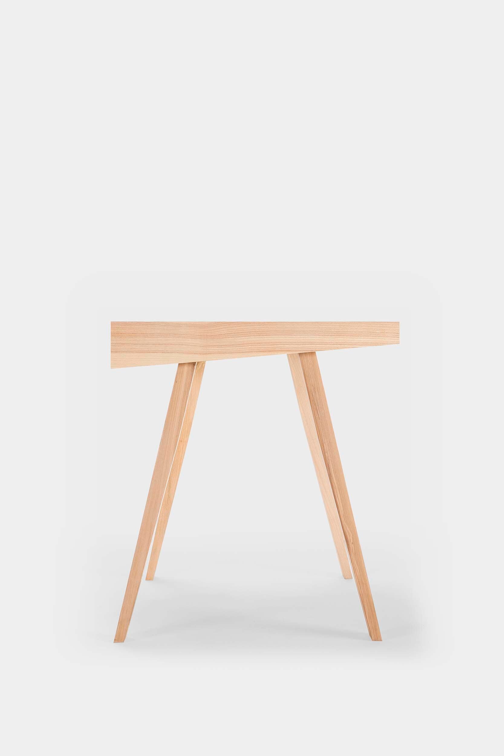 Aquamarine Poppy 4.9 desk, a modern furniture piece with a sleek surface and sturdy design, suitable for home or office use.