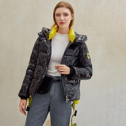 Warm women’s winter parka coat by Jade with shiny, hooded design and long sleeves, ideal for cold weather.