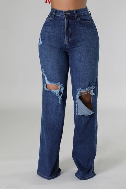 Dark denim Jade Icarus wide leg jeans with a relaxed fit and high waist, shown on a model standing outdoors.
