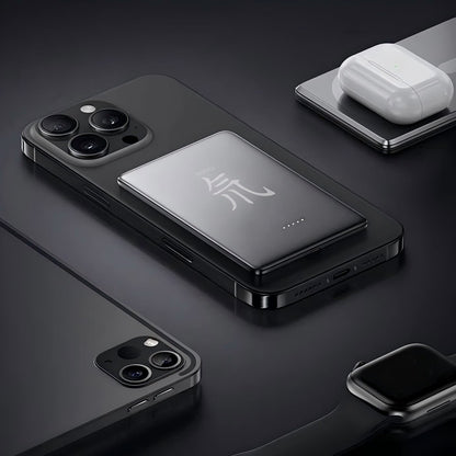 Gray titanium power bank with magnetic shell by Gold Penelope, portable tech accessory, showing sleek design and alloy construction.