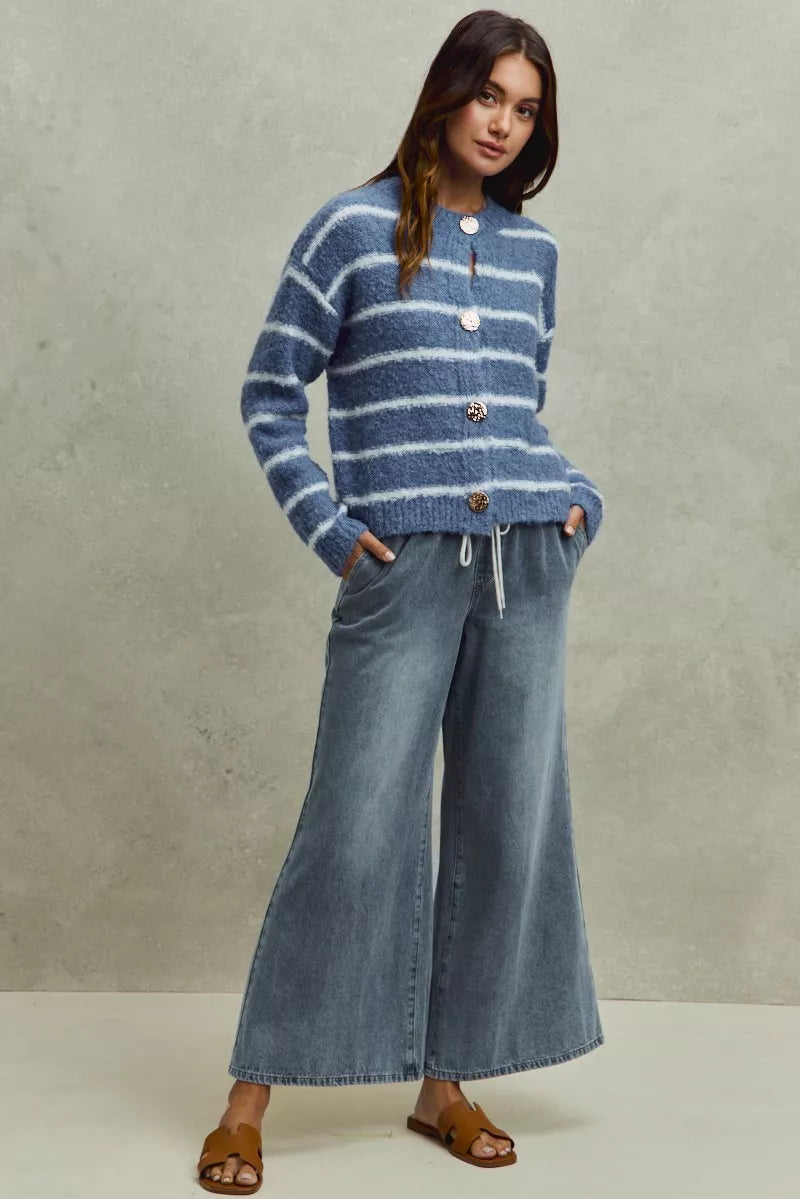 Pear Daisy SO ME Mid Rise Elastic Waist Flare Denim Jeans, showcasing the stylish fit and classic denim texture.