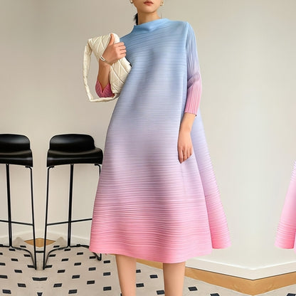Plus size pleated dress for women by Carmine Juneberry, featuring a flowy, elegant design with a flattering fit.