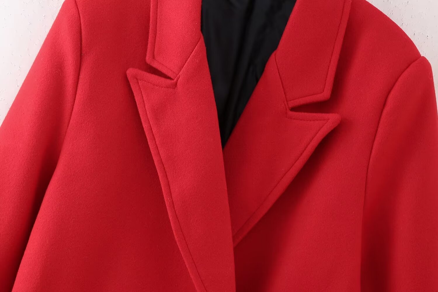 Red double-breasted long overcoat by Carmine Juneberry, stylish jackets and coats with classic lapels and button details.