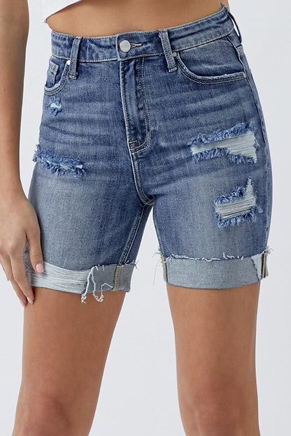 Distressed rolled denim shorts with pockets by Jade Icarus, styled for a casual automotive-inspired look.