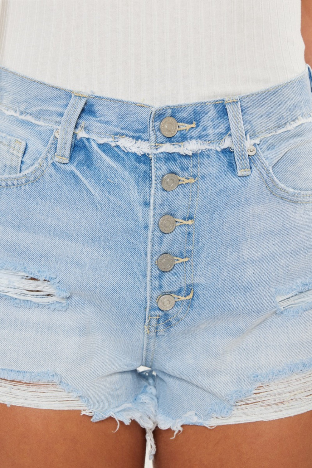 Distressed Kancan denim shorts with button fly, styled for automotive-themed fashion, by Jade Icarus, featuring frayed edges and a casual fit.