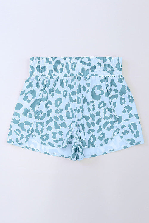 Byzantium Bay leopard and checker high waist athletic shorts, black and beige pattern, stretchy fabric, close-up view.