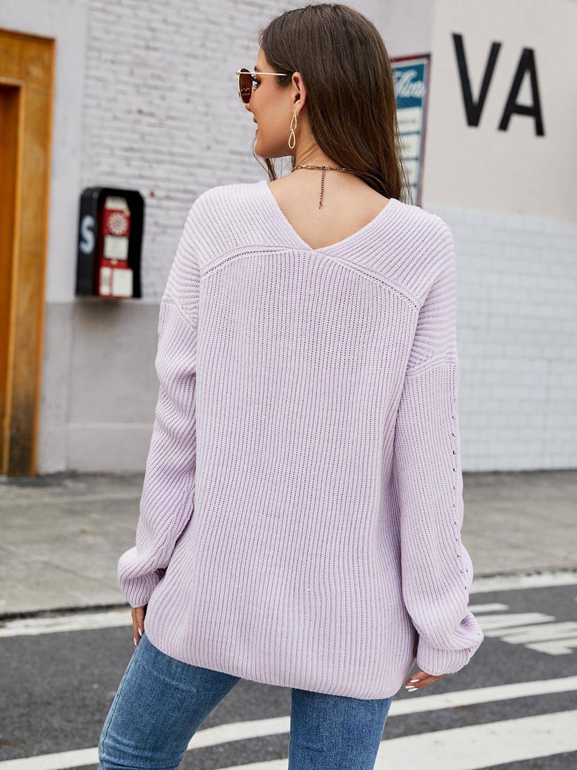 Carmine Juneberry V-neck rib-knit top in soft fabric, close-up of fitted style with ribbed texture and short sleeves.