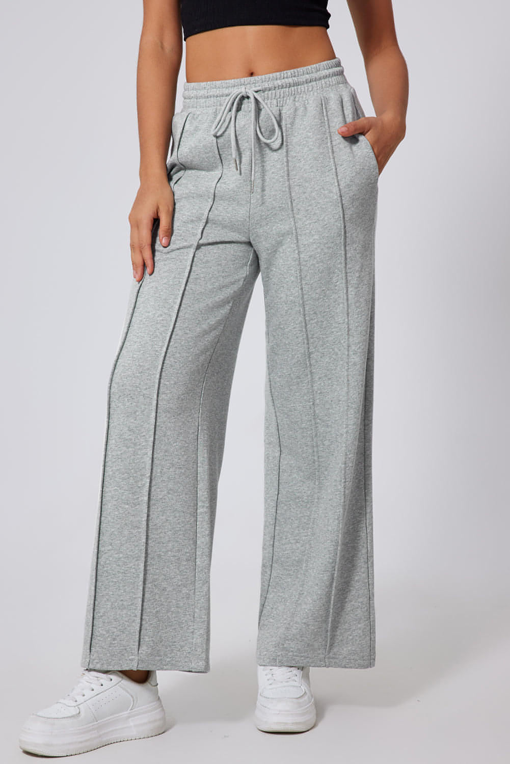Gray seamed drawstring high waist wide-leg sweatpants by Carmine Juneberry, shown with relaxed fit and elastic waistband.