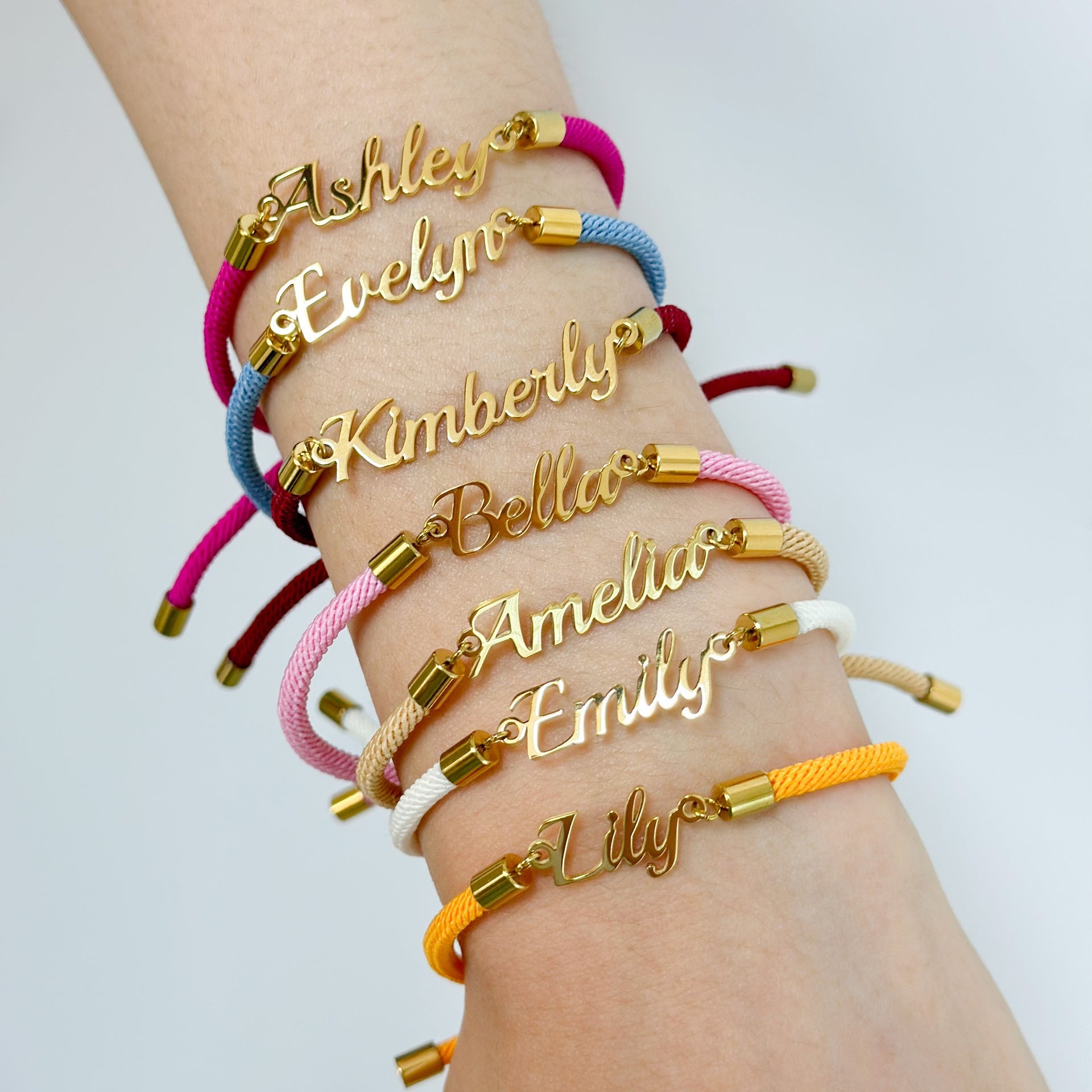 Colorful personalized rope chain bracelet with custom name, pink lucky brand jewelry for women, close-up of vibrant design