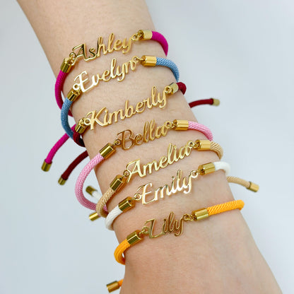 Colorful personalized rope chain bracelet with custom name, pink lucky brand jewelry for women, close-up of vibrant design