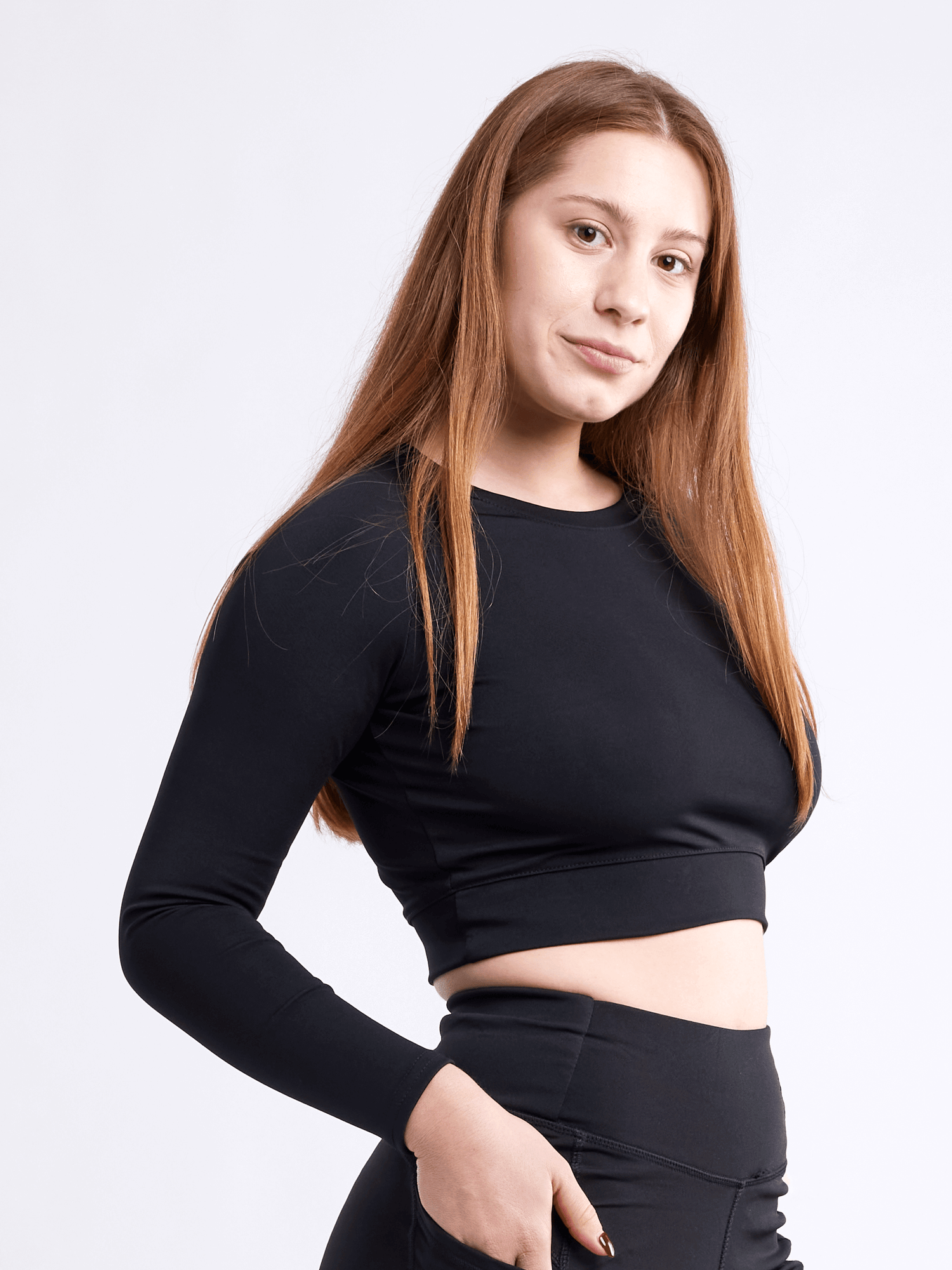 Black Lavender JupiterGear long-sleeve crop top, activewear with fitted design and crew neckline, shown on model.