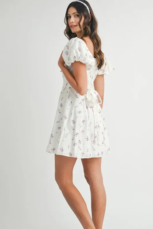 Pear Daisy MABLE floral print puff sleeve mini dress, perfect for casual home gatherings, featuring vibrant blooms and a stylish silhouette.
