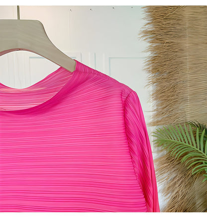 Plus size pleated dress for women by Carmine Juneberry, featuring a flowing design and elegant fit.