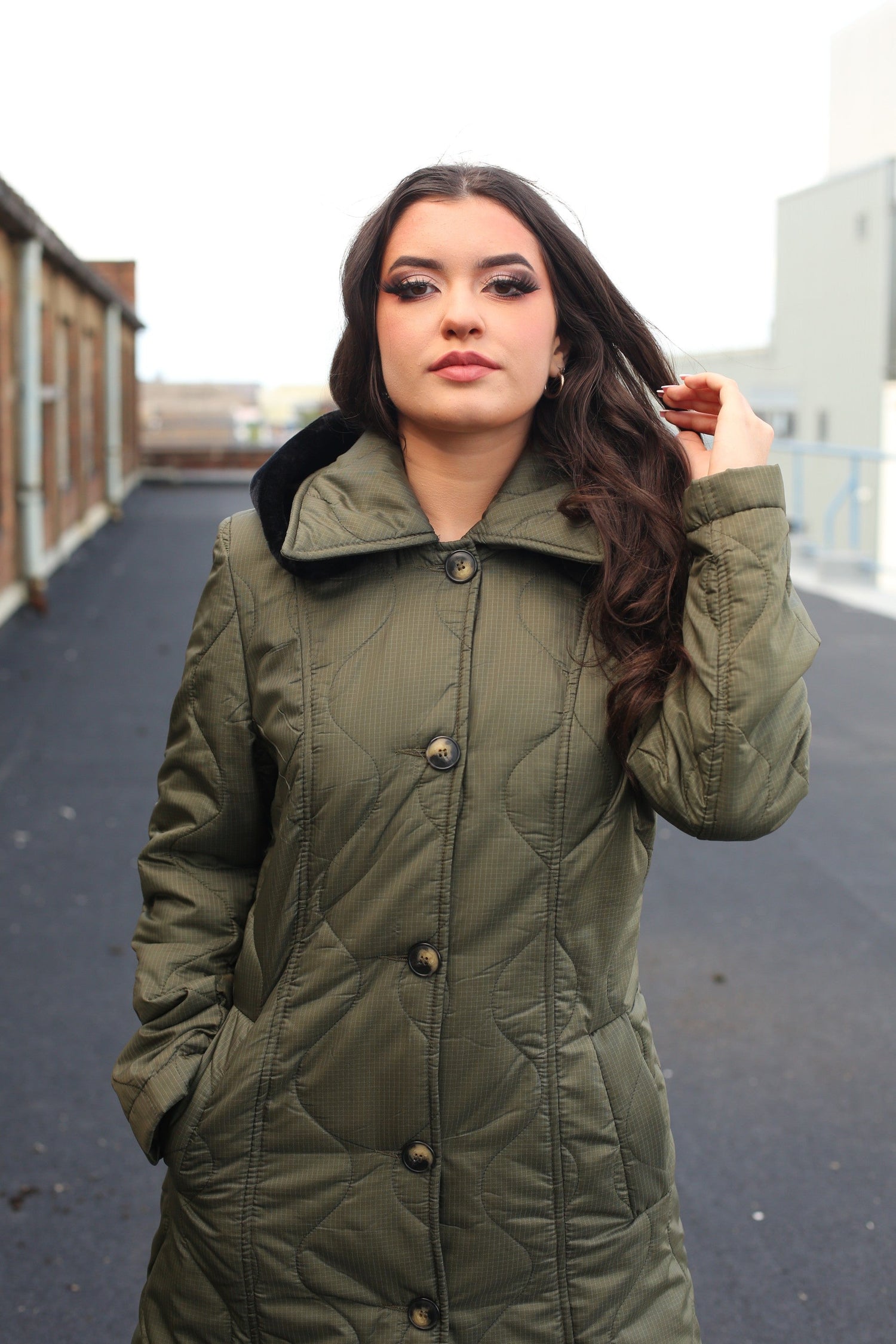 Rose Eleusis quilted single-breasted longline hooded coat in olive green, stylish jacket with a padded, insulated design.