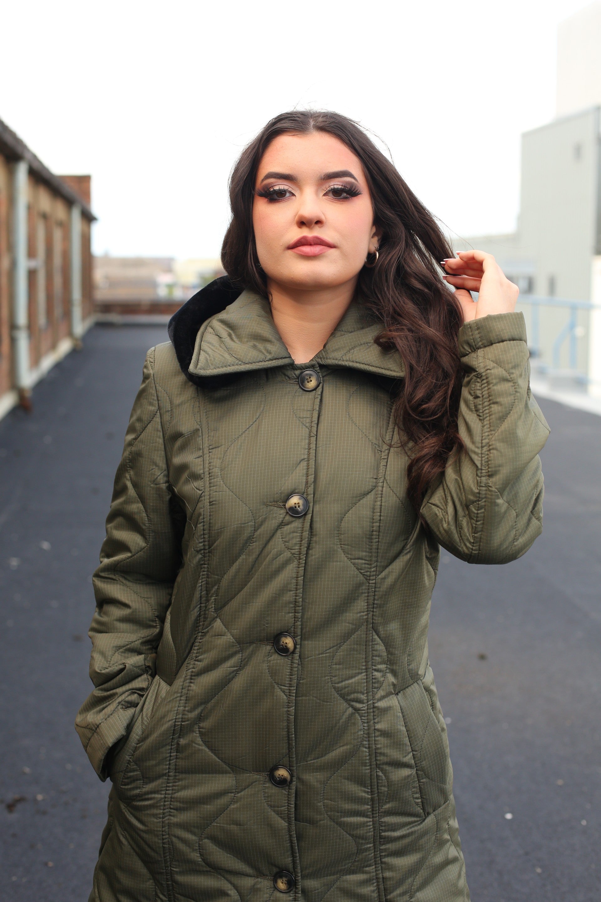 Rose Eleusis quilted single-breasted longline hooded coat in olive green, stylish jacket with a padded, insulated design.