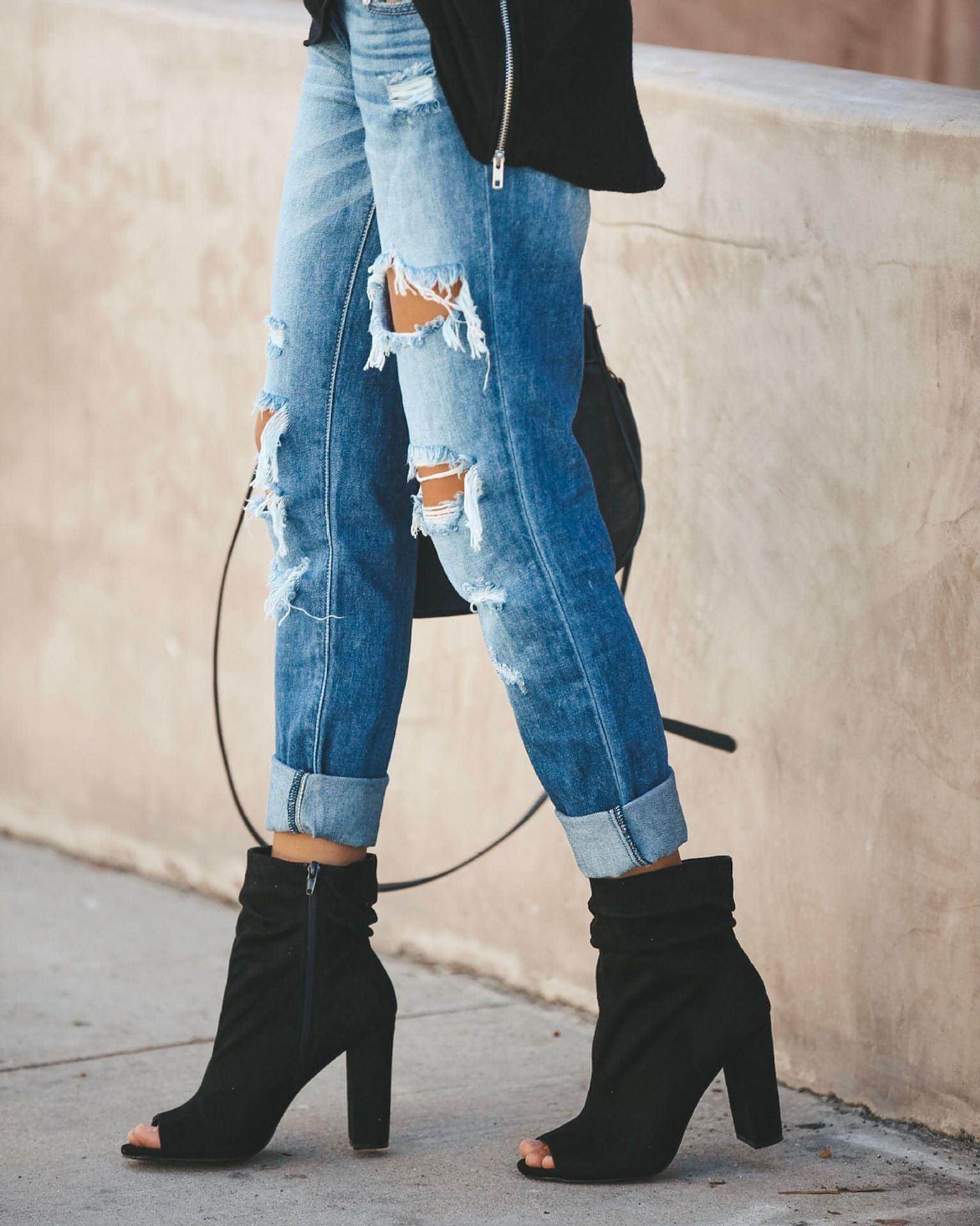Carmine Juneberry large ripped jeans with distressed detailing and a relaxed fit, shown on a model.
