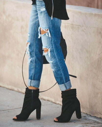 Carmine Juneberry large ripped jeans with distressed detailing and a relaxed fit, shown on a model.