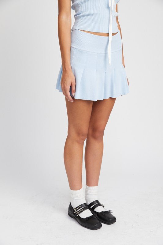 Automotive Jade Icarus low waist pleated mini skirt with automotive-inspired design, displayed on a mannequin.