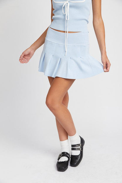 Automotive low waist pleated mini skirt by Jade Icarus, featuring a stylish design with pleats and a modern fit.