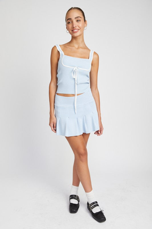 Automotive low waist pleated mini skirt by Jade Icarus, shown in a stylish design with pleats and a modern fit.