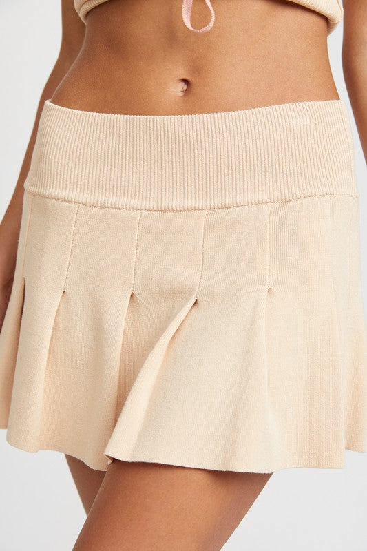 Automotive Jade Icarus low waist pleated mini skirt with stylish pleats, designed for a fashionable look.