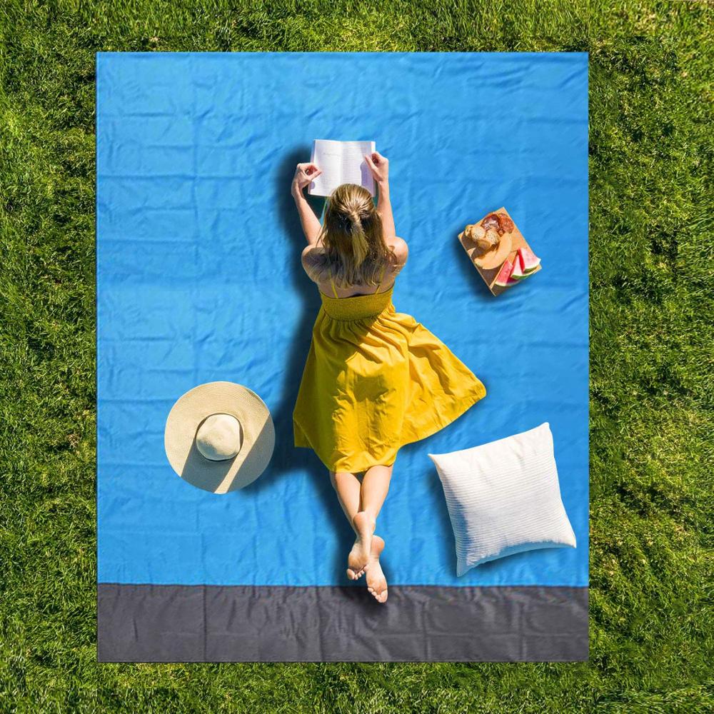 Maroon Asteria portable waterproof camping beach picnic mat with pocket, ideal for outdoor gatherings and beach trips.