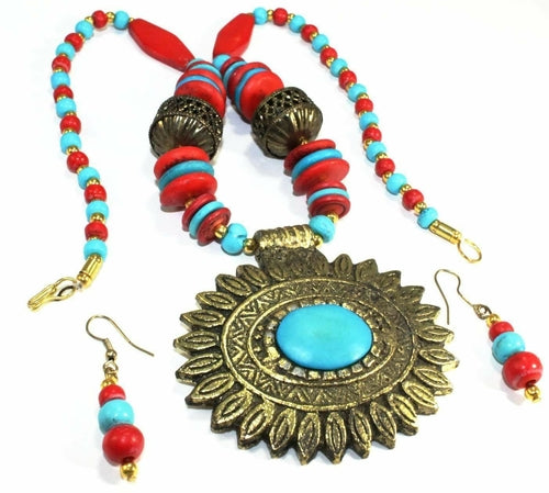 Silver Hestia flower medallion boho necklace and earrings set featuring floral designs and intricate silver detailing.