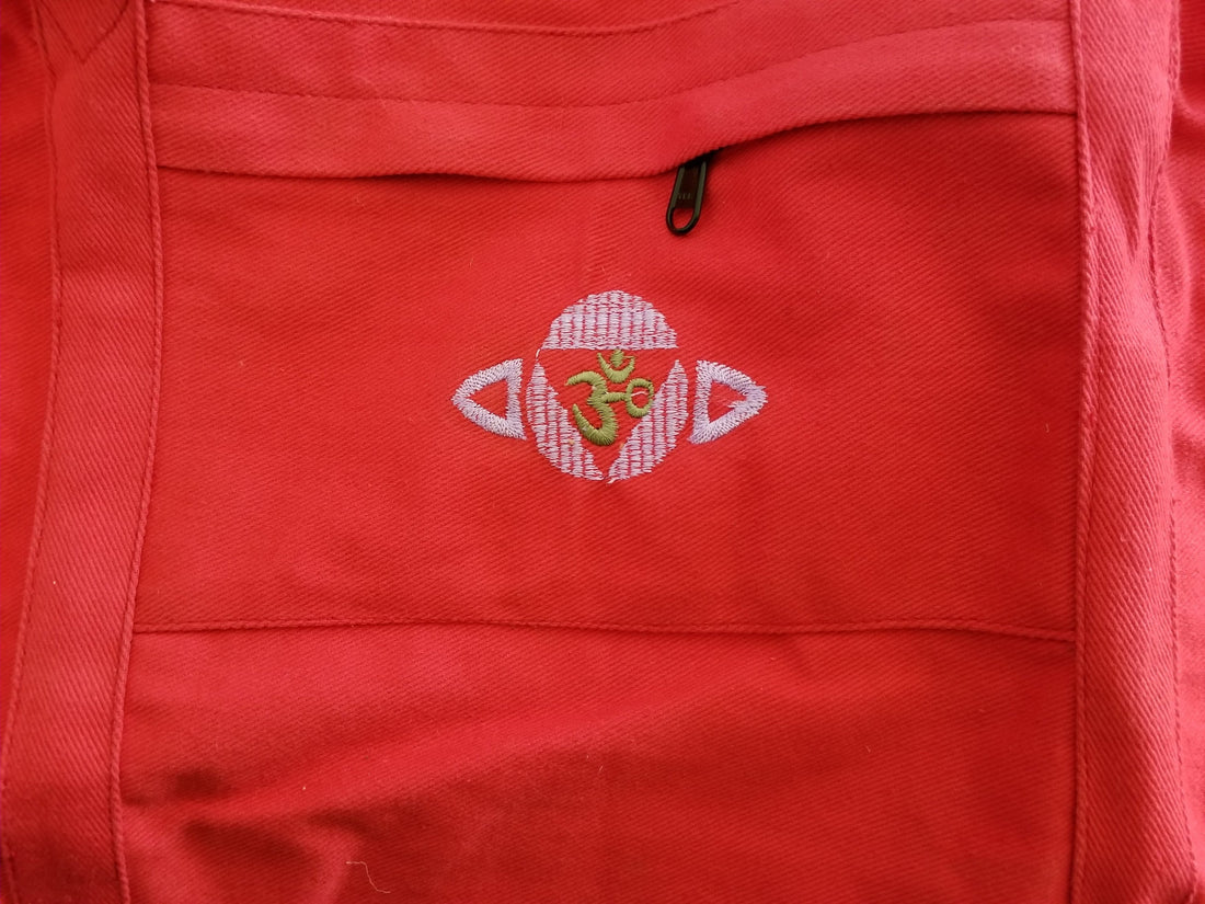 Alabaster Chakra Yoga Kit Bag for sports and outdoors, featuring a spacious design with multiple compartments and colorful chakra patterns.