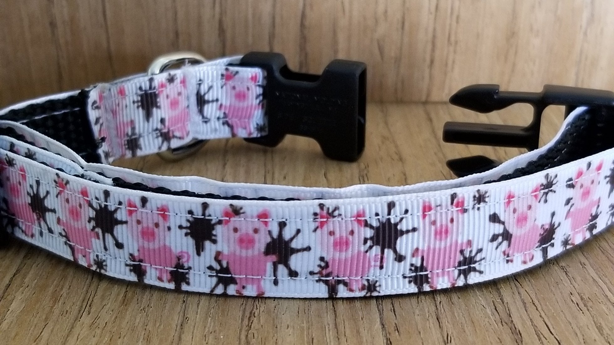 Green Thalassa small pet collar featuring playful pigs in the mud design, ideal for leash and petwear accessories.