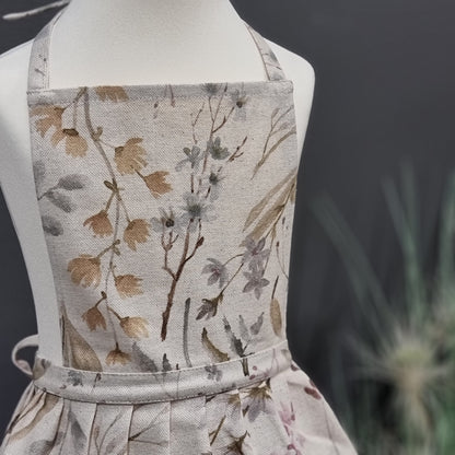 Kids’ linen-cotton mix apron with ruffles and printed design, perfect for children’s home decor by Rose Trillium.