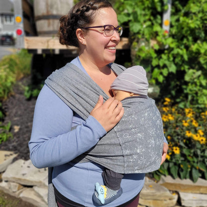 Soft pink baby clothing by Amber Leto, featuring a cozy Snüg design for comfortable infant wear.
