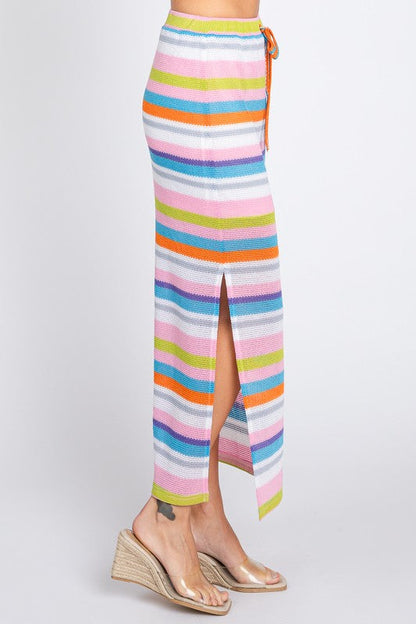 Multi-color stripe maxi skirt by Jade Icarus, featuring vibrant horizontal stripes and flowing fabric in a full-length design.