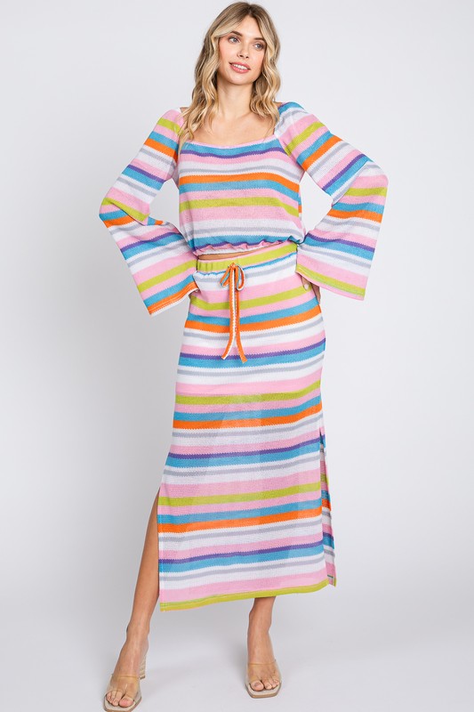 Multi-color stripe maxi skirt by Jade Icarus, featuring vibrant horizontal stripes and flowing fabric.