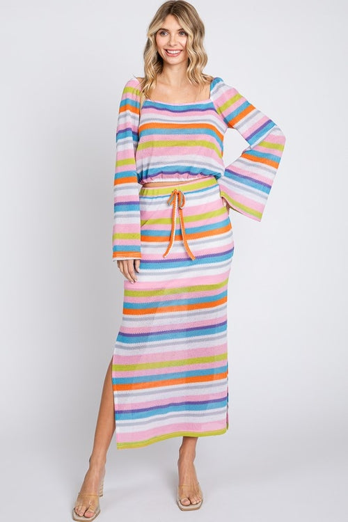 Multi-color striped maxi skirt by Jade Icarus, featuring vibrant horizontal stripes and flowing fabric in the image.